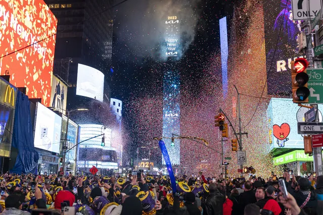Fireworks are set off at midnight during the Times Square New Year's celebration, Sunday, January 1, 2023, in New York. (Photo by Photo by Ben Hider/Invision/AP Photo)