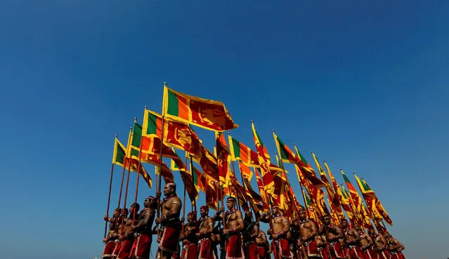 Sri Lanka's military members march with the national flags at the parade during a rehearsal for Sri Lanka's 70th Independence day celebrations in Colombo, Sri Lanka February 2, 2018. (Photo by Dinuka Liyanawatte/Reuters)