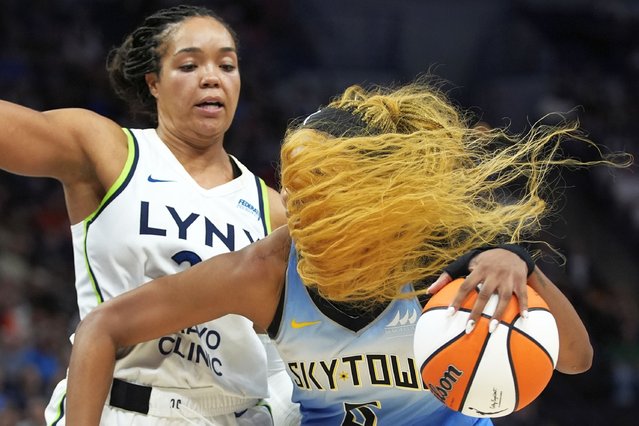 Chicago Sky forward Angel Reese, right, works toward the basket as Minnesota Lynx forward Napheesa Collier defends during the second half of a WNBA basketball game Tuesday, July 22, 2025, in Minneapolis. (Photo by Abbie Parr/AP Photo)