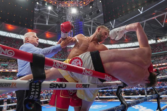 Ukraine's Daniel Lapin is thrown on the ropes by United Kingdom's Lewis Edmondson during a light-heavyweight championship fight in London, Saturday, July 19, 2025. (Photo by Frank Augstein/AP Photo)