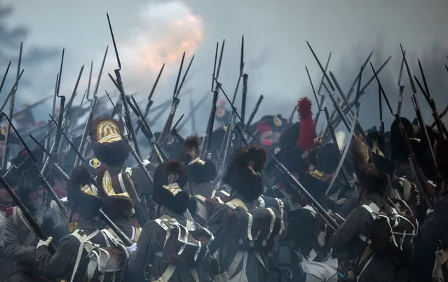 Members of military history clubs dressed up in historic uniforms fight during an re-enactment of the Battle of Austerlitz in Austerlitz (Slavkov) near Brno, Czech Republic, November 29, 2014. (Photo by Filip Singer/EPA)