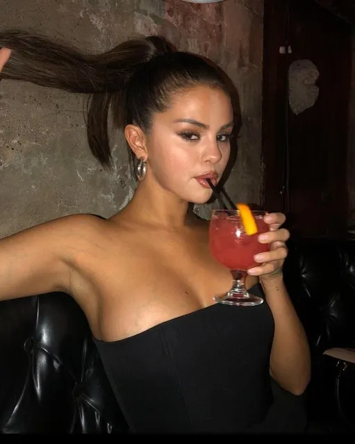 American singer Selena Gomez in the last decade of February 2023  seductively sips a drink while fending off Hailey Bieber drama. (Photo by selenagomez/Instagram)