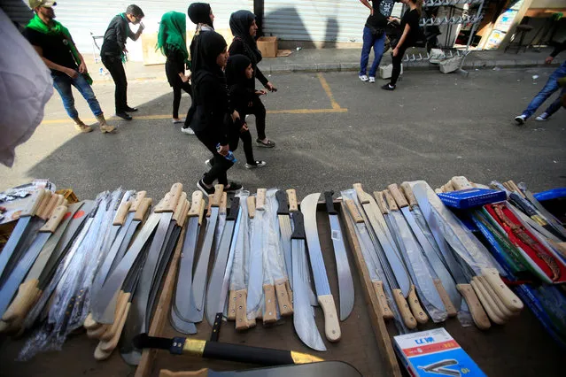 Knifes are displayed for sale during commemorations for Ashura in Nabatiyeh, Lebanon October 11, 2016. (Photo by Ali Hashisho/Reuters)