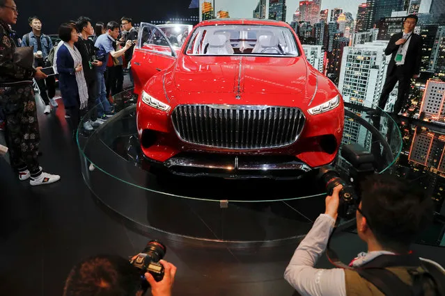 People check Mercedes-Maybach Ultimate Luxury during a media preview at the Auto China 2018 motor show in Beijing, China on April 25, 2018. (Photo by Damir Sagolj/Reuters)