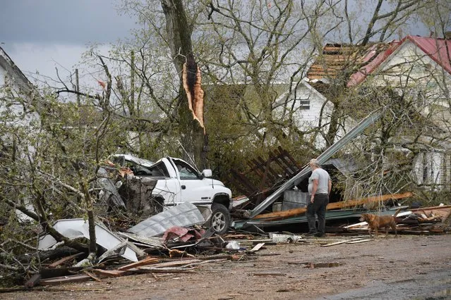 A man surveys the wreckage and debris outside his destroyed home on April 5, 2023 in Glenallen, Missouri. At least four people have reportedly been killed and multiple others injured following an early morning tornado which tore through parts of southeastern Missouri on Wednesday. (Photo by Michael B. Thomas/Getty Images)