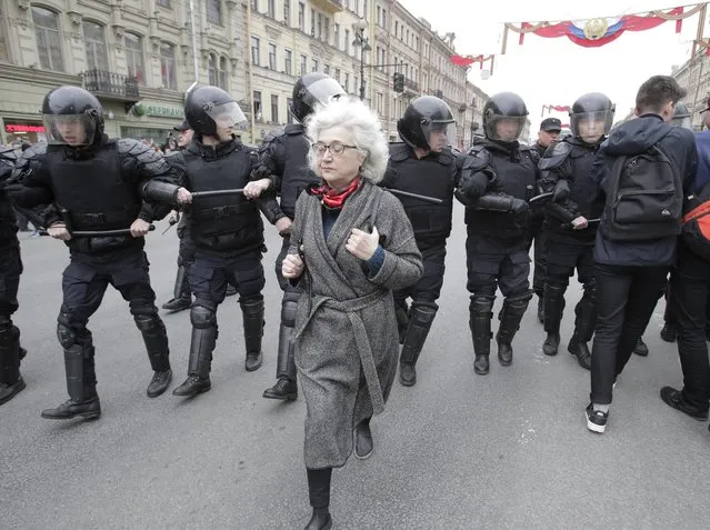 Russian police block protesters during a demonstration against President Vladimir Putin in St.Petersburg, Russia, Saturday, May 5, 2018. (Photo by Dmitri Lovetsky/AP Photo)