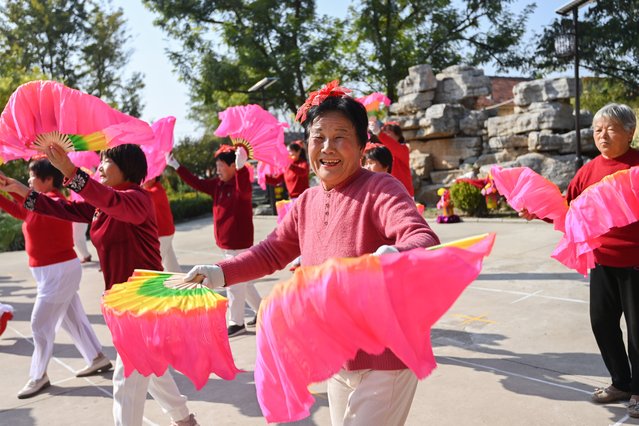 Senior citizens perform yangge dance at Gaoliu Town in Qingzhou City of east China's Shandong Province, October 27, 2025. A series of celebration activities were held across the country to mark China's Chongyang Festival, which will fall on Oct. 29 this year. Also known as Seniors' Day in China nowadays, it highlights the public's care for older people. (Photo by Xinhua News Agency/Rex Features/Shutterstock)