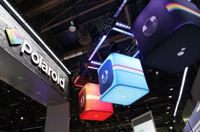 Giant versions of the Polaroid Cube HD action camera are displayed at the Polaroid booth ahead of the International Consumer Electronics show (CES) in Las Vegas, Nevada, January 5, 2015. (Photo by Rick Wilking/Reuters)
