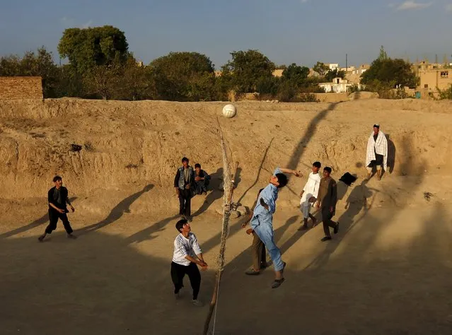 Afghan men play volleyball in Kabul, Afghanistan October 22, 2015. (Photo by Mohammad Ismail/Reuters)