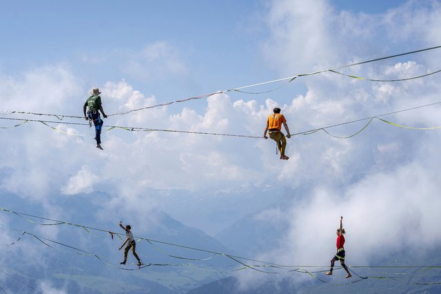 Athletes competes during the Highline World Championships on Friday, 17 July 2024, on the summit of Crap Sogn Gion in Laax, Switzerland. (Phoot by Yanik Buerkli/Keystone via AP Photo)
