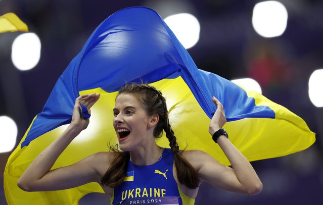 Yaroslava Mahuchikh of Ukraine celebrates winning in the Women High Jump final of the Athletics competitions in the Paris 2024 Olympic Games, at the Stade de France stadium in Saint Denis, France, 04 August 2024. (Photo by Yoan Valat/EPA/EFE)