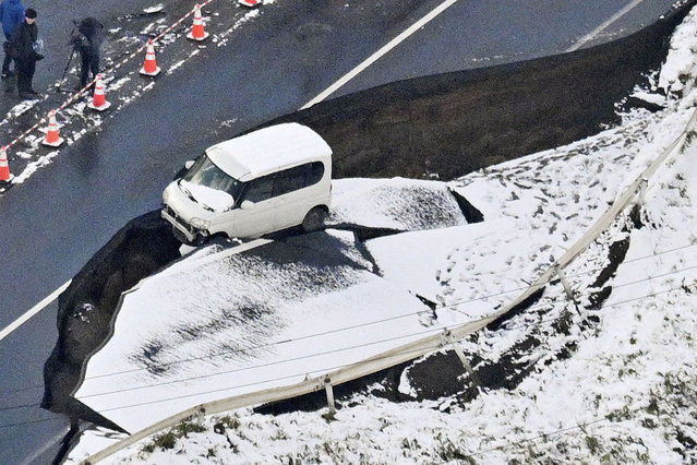 A collapsed road is pictured in Tohoku in Aomori Prefecture, northeastern Japan, on December 9, 2025, following a strong earthquake the previous night. (Photo by KYODO News/Reuters)
