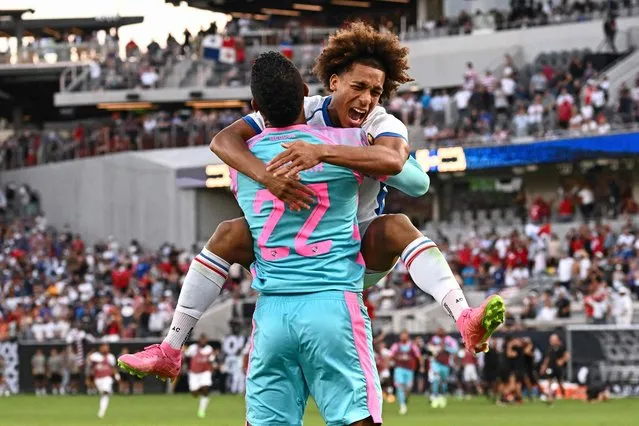 Panama's midfielder Adalberto Carrasquilla (R) celebrates with Panama's goalkeeper Orlando Mosquera after scoring the winning penalty kick during the Concacaf 2023 Gold Cup semifinal football match between Panama and USA at Snapdragon Stadium in San Diego, California on July 12, 2023. (Photo by Patrick T. Fallon/AFP Photo)
