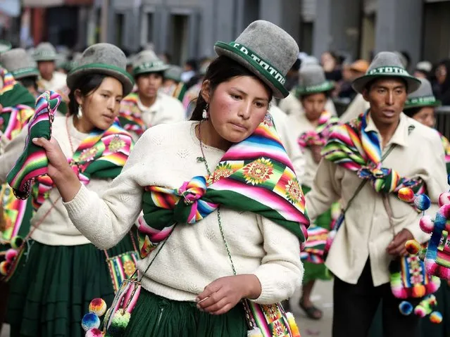 Indigenous people dance during the Anata Andina (Andean carnival) parade in Oruro, February 12, 2015. (Photo by David Mercado/Reuters)