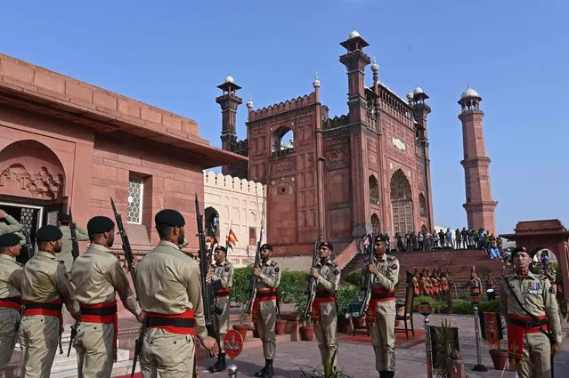 Pakistani soldiers stand guard at the tomb of national poet Allama Mohammad Iqbal during country's Independence Day celebrations in Lahore on August 14, 2023. (Photo by Arif Ali/AFP Photo)
