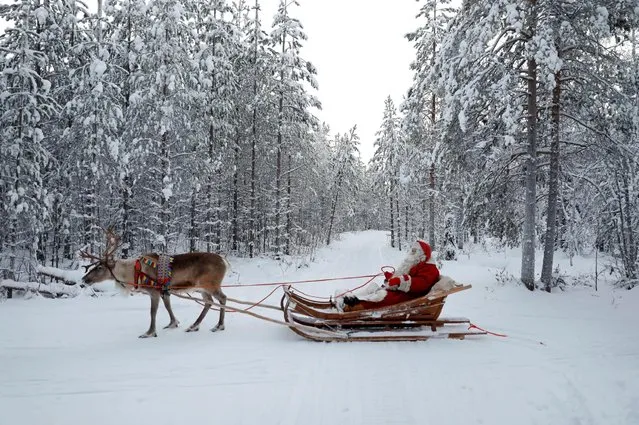 Santa Claus rides in his sleigh as he prepares for Christmas in the Arctic Circle near Rovaniemi, Finland December 15, 2016. (Photo by Pawel Kopczynski/Reuters)