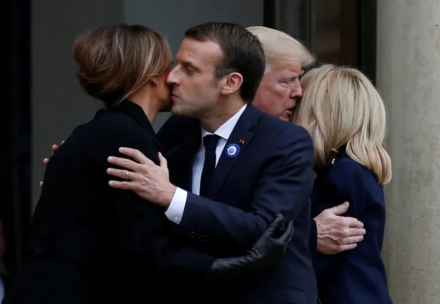 French President Emmanuel Macron and his wife Brigitte Macron accompany U.S. President Donald Trump and first lady Melania Trump after a meeting at the Elysee Palace on the eve of the commemoration ceremony for Armistice Day, 100 years after the end of the First World War, in Paris, France, November 10, 2018. (Photo by Vincent Kessler/Reuters)