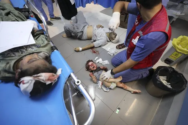 Palestinians wounded in Israeli strikes are brought to Shifa Hospital in Gaza City on Wednesday, October 11, 2023. (Photo by Ali Mahmoud/AP Photo)