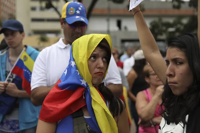 Members of the opposition gather to propose amnesty laws for police and military, in Las Mercedes neighborhood of Caracas, Venezuela, Saturday, January 29, 2019. (Photo by Rodrigo Abd/AP Photo)