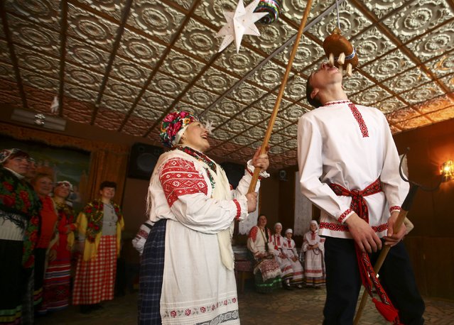 Local residents take part in a contest during the celebrations of Kolyada pagan holiday, which over the centuries has merged with Orthodox Christmas festivities and marks the upcoming end of winter, in the village of Noviny, Belarus, January 21, 2017. (Photo by Vasily Fedosenko/Reuters)