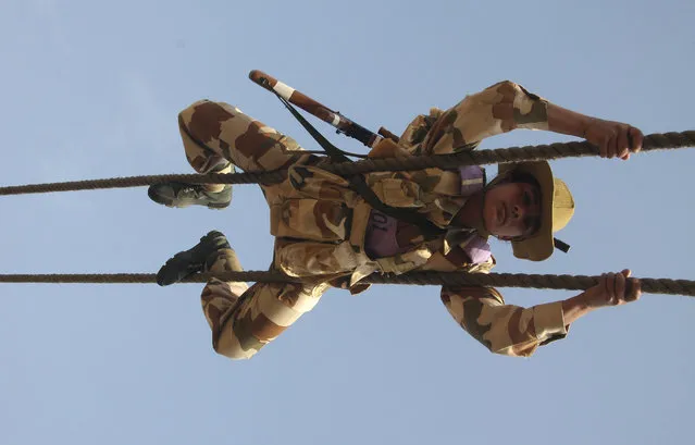 A female recruit from the Indo-Tibetan Border Police (ITBP) takes part in a training session in an ITBP training centre at Bhanu, Haryana, January 27, 2010. (Photo by Ajay Verma/Reuters)