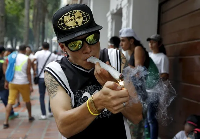 A man smokes marijuana during a demonstration in support of the legalization of marijuana in Medellin, May 2, 2015. (Photo by Fredy Builes/Reuters)
