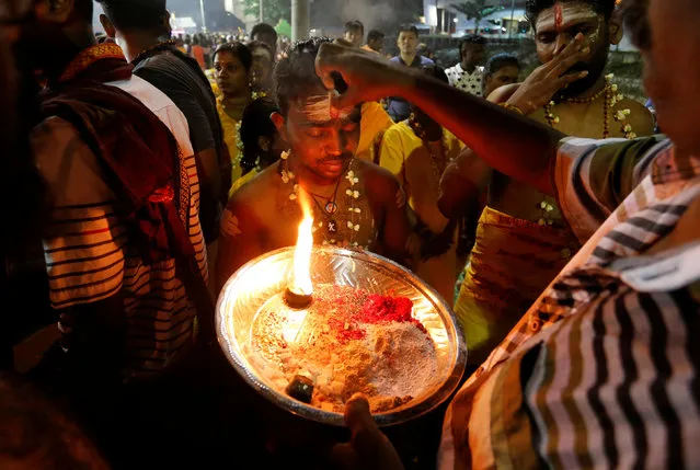 Devotees receive blessings in Batu Caves during the Hindu festival of Thaipusam in Kuala Lumpur, Malaysia February 9, 2017. (Photo by Lai Seng Sin/Reuters)