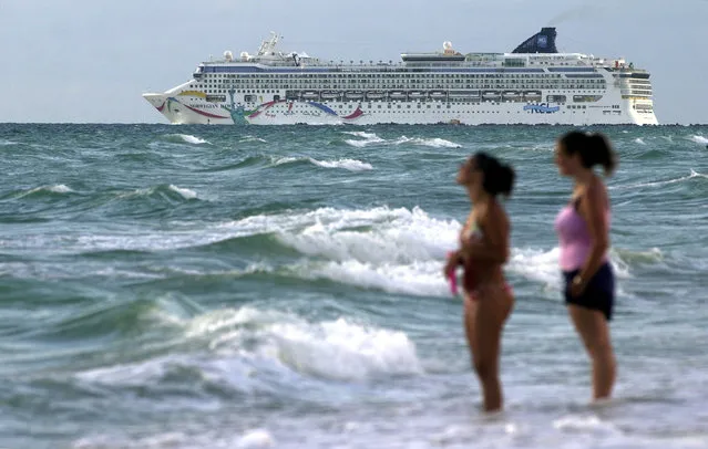 In this September 1, 2004, file photo, the cruise ship Norwegian Dawn heads out into the Atlantic Ocean from the southern tip of Miami Beach, Fla. An official with Bermuda's Rescue Coordination Center says the ship Norwegian Dawn hit the reef near Bermuda's North Channel, Tuesday, May 19, 2015. (Photo by Bill Cooke/AP Photo)