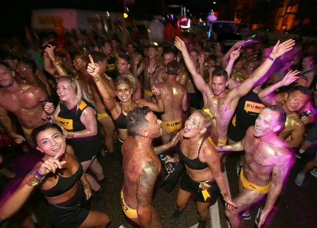 Participants dance before for the annual Gay and Lesbian Mardi Gras parade in Sydney, Saturday, March 4, 2017. (Photo by Rick Rycroft/AP Photo)