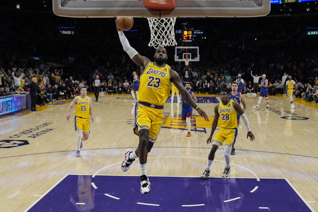 Los Angeles Lakers forward LeBron James (23) dunks during the first half of Game 3 of an NBA basketball first-round playoff series against the Denver Nuggets in Los Angeles, Thursday, April 25, 2024. (Photo by Ashley Landis/AP Photo)