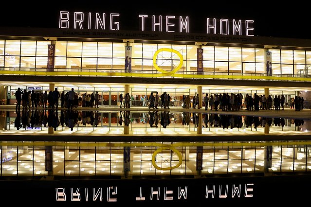 People walk near the “Bring them home” sign, as today marks 200 days since people were taken hostages by the Palestinian Islamist group Hamas during the deadly October 7 attack on Israel, amid the ongoing conflict between Israel and Hamas, in Tel Aviv, Israel on April 24, 2024. (Photo by Hannah McKay/Reuters)