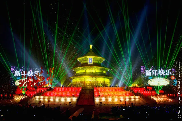 The Temple of Heaven (The Qi Nian Temple) is illuminated as Beijing celebrates the New Year's Eve at the Temple of Heaven Park