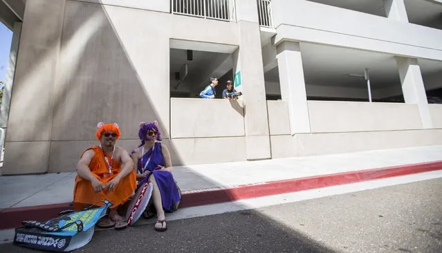 Cosplay enthusiasts Phil and Claudia, dressed like characters of “The Case of the Cola Cult” from “Chip 'n Dale Rescue Rangers” wait during the 2015 Comic-Con International Convention in San Diego, California July 10, 2015. (Photo by Mario Anzuoni/Reuters)