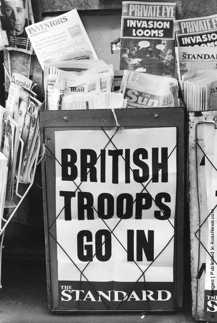 An Evening Standard headline on a London newspaper stand during the Falklands War reads 'British Troops Go In', May 1982