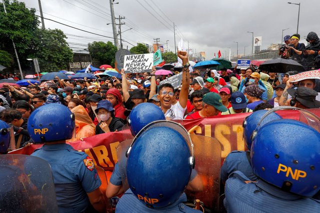 Demonstrators march along the main road heading to the House of Representatives ahead of the third State of the Nation Address by Philippine President Ferdinand Marcos Jr. in Quezon City, Philippines, Monday, July 22, 2024. (Photo by Mark Cristino/AP Photo)