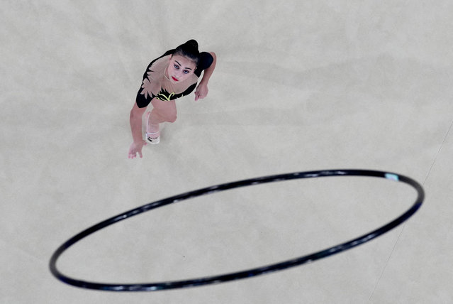 Azerbaijan's Zohra Aghamirova performs with the hoop in the rhytmic gymnastics' individual all-around qualification during the Paris 2024 Olympic Games at the Porte de la Chapelle Arena in Paris, on August 8, 2024. (Photo by Athit Perawongmetha/Reuters)