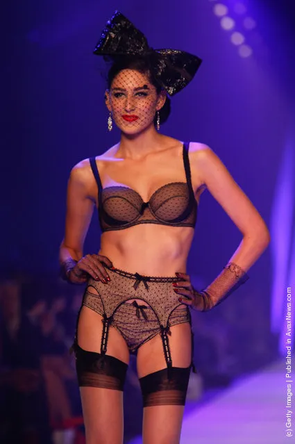 Models showcases designs by Von Folies by Dita Von Teese on the runway during L'Oreal Melbourne Fashion Festival