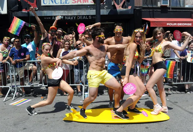 Pride marchers with the Greater Fort Lauderdale Convention & Visitors Bureau entertain spectators at the New York Gay Pride Parade, Sunday, June 29, 2014.  (Photo by Diane Bondareff/Invision for Greater Fort Lauderdale Convention & Visitors Bureau/AP Images)