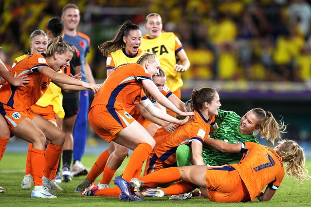 Dutch players celebrate defeating Colombia in a penalty shoot-out of a U-20 Women's World Cup quarterfinal soccer match at Pascual Guerrero Olympic stadium in Cali, Colombia, Sunday, September 15, 2024. (Photo by Fernando Vergara/AP Photo)