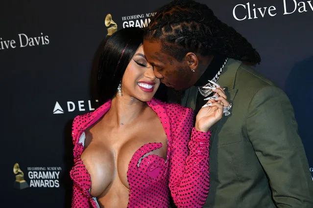 US rapper Cardi B (L) and boyfriend Offset arrive for the Recording Academy and Clive Davis pre-Grammy gala at the Beverly Hilton hotel in Beverly Hills, California on January 25, 2020. (Photo by Mark Ralston/AFP Photo)