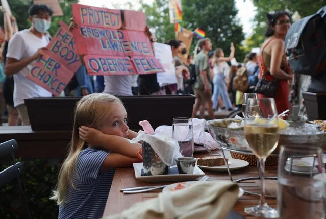 A child reacts as abortion rights protesters demonstrate after the U.S. Supreme Court ruled in the Dobbs v Women’s Health Organization abortion case, overturning the landmark Roe v Wade abortion decision in Boston, Massachusetts, U.S., June 24, 2022. (Photo by Brian Snyder/Reuters)