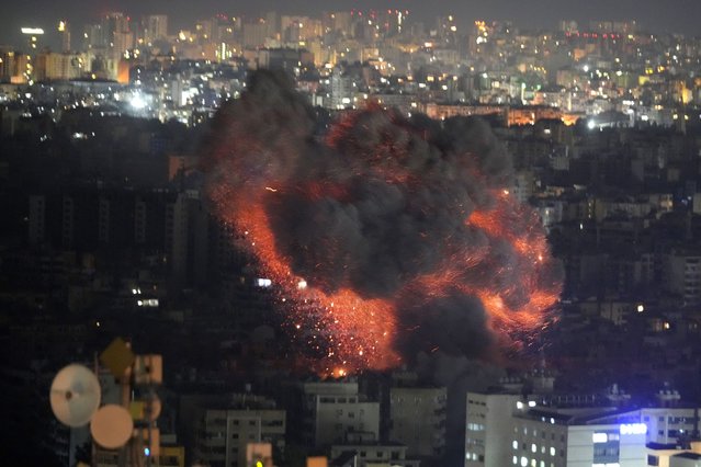 Flame and smoke rises from an Israeli airstrike on Dahiyeh, in the southern suburb of Beirut, Lebanon, early Sunday, October 27, 2024. (Photo by Hussein Malla/AP Photo)