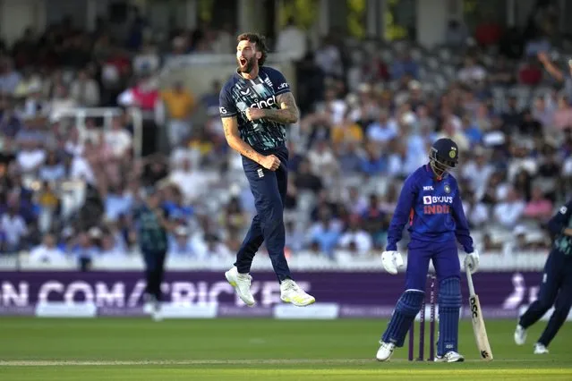 England's Reece Topley celebrates taking his sixth wicket, that of India's Prasidh Krishna, right, during the second one day international cricket match between England and India at Lord's cricket ground in London, Thursday, July 14, 2022. England won the match by 100 runs. (Photo by Matt Dunham/AP Photo)