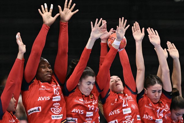 Spain's players block a shoot during the women's EHF 2024 European championship handball game between Spain and Portugal at the St Jakobshalle in Basel on November 28, 2024. (Photo by Sebastien Bozon/AFP Photo)