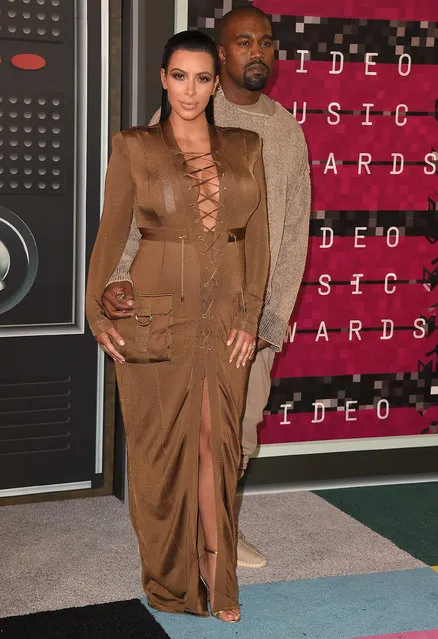 Rapper Kanye West (R) and TV personality Kim Kardashian attend the 2015 MTV Video Music Awards at Microsoft Theater on August 30, 2015 in Los Angeles, California. (Photo by Steve Granitz/WireImage)