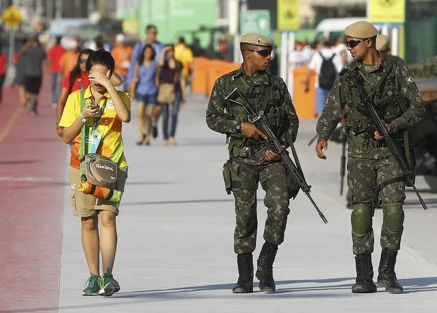 2016 Rio Olympics, Opening Ceremony, Olympic Park, Rio de Janeiro, Brazil on August 5, 2016. Soldiers patrol ahead of the opening ceremony. (Photo by Leonard Foeger/Reuters)