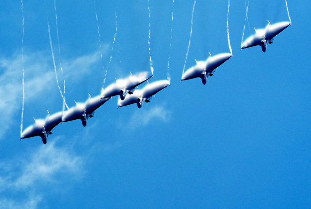 The Russian Knights aerobatic team performs in the sky on day 5 of the 15th China International Aviation and Aerospace Exhibition, or Airshow China 2024, on November 16, 2024 in Zhuhai, Guangdong Province of China. (Photo by Zhou Guoqiang/VCG via Getty Images)