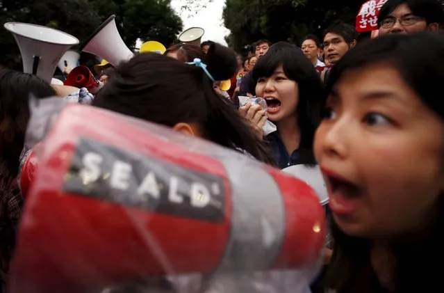 Members of protest group Students Emergency Action for Liberal Democracy (SEALDs), shout slogans during a rally against Japan's Prime Minister Shinzo Abe's security bill and his administration in front of the parliament in Tokyo, September 18, 2015. The Japanese government began a final push on Friday to enact contentious defence legislation that could let its troops fight overseas for the first time since World War Two, despite public protests and delaying tactics by the opposition. (Photo by Yuya Shino/Reuters)