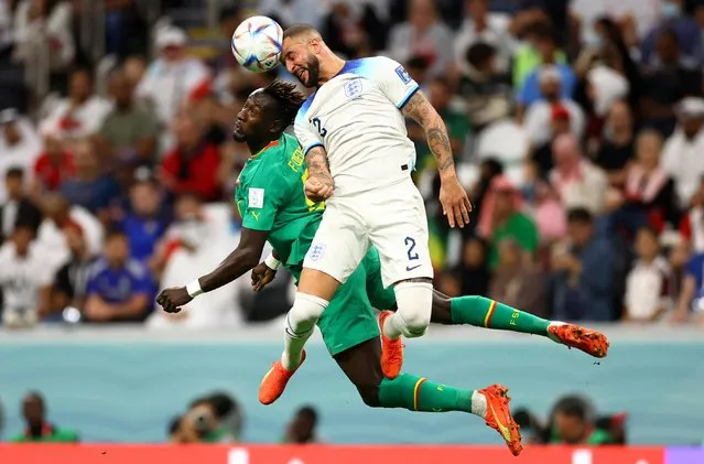 Kyle Walker (2) of England in action against Famara Diedhiou (19) of Senegal during the FIFA World Cup Qatar 2022 Round of 16 match between England and Senegal at Al Bayt Stadium in Al Khor, Qatar on December 04, 2022. (Photo by Carl Recine/Reuters)