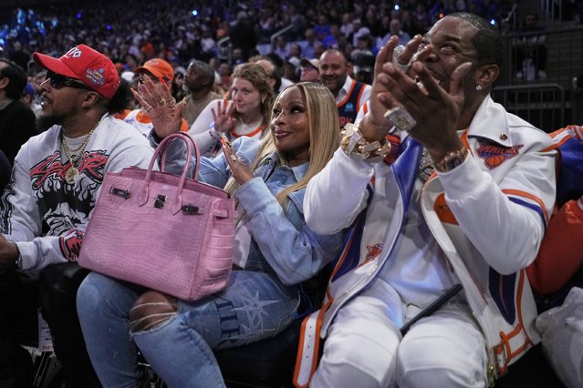 Mary J. Blige, center, and Busta Rhymes, right, react during Game 1 of the NBA basketball Eastern Conference final between the New York Knicks and the Indiana Pacers, Wednesday, May 21, 2025, in New York. (Photo by Frank Franklin II/AP Photo)